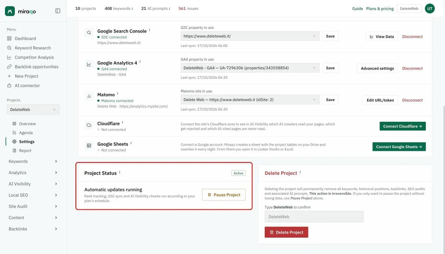 The Project Status card, highlighted, with the Active label, the Automatic updates running note and the Pause Project button; next to it, the red Delete Project zone with the confirmation field