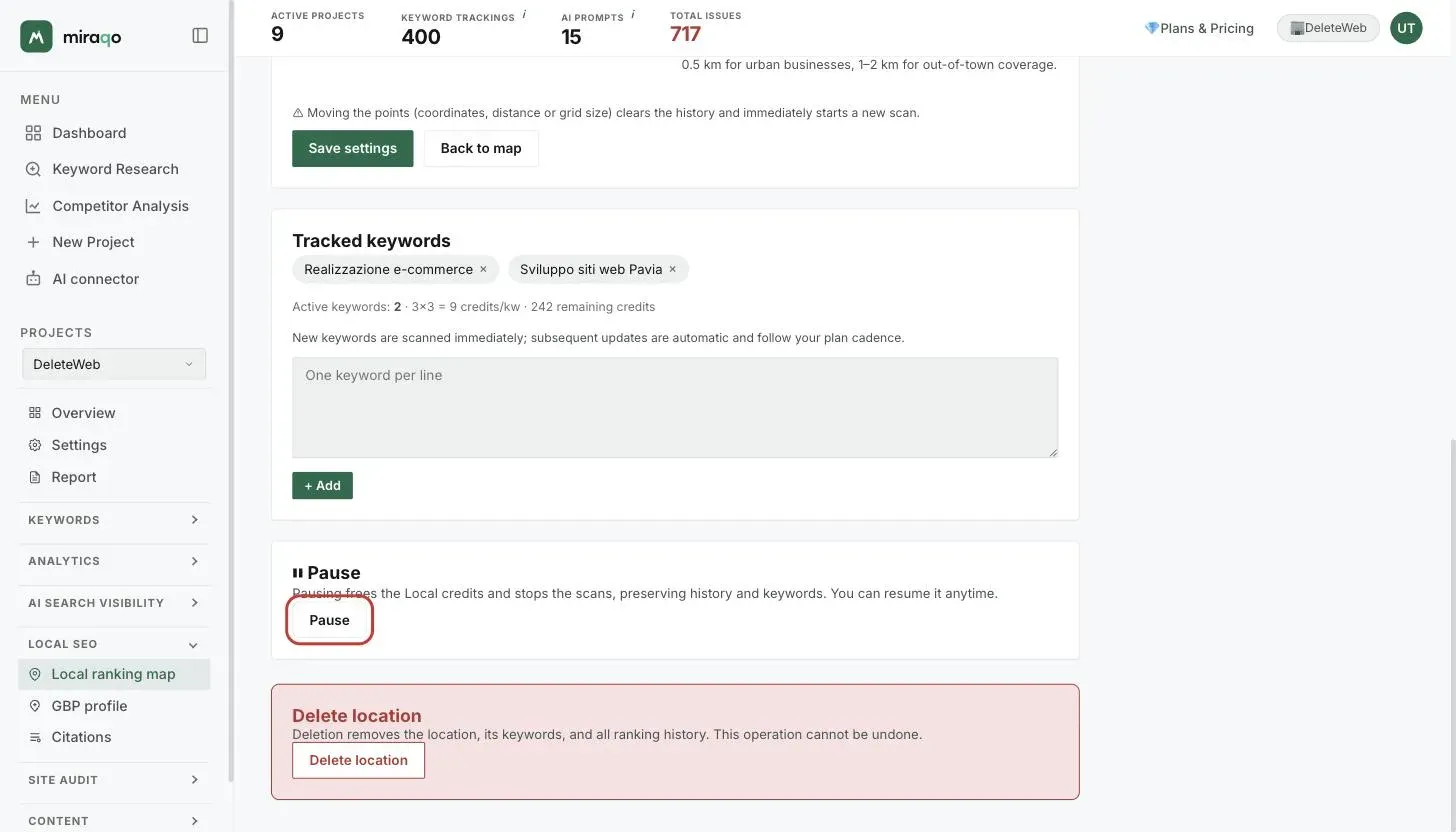 The bottom part of the edit page: the notice that moving the points clears the history, the Tracked keywords card with the keyword pills, the credits per keyword and the textarea to add more, the Pause card with the highlighted button and, at the bottom, the Delete location danger zone